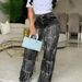 Autumn Winter Women's Fashion Tassel Denim Jeans Button Decoration Loose Straight Jeans European American Style_mkmklike.com