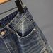 Men's Slim Fit Motorcycle Jeans Trendy Edgy Zipper Pockets Patchwork Design Tapered Leg mid Waist Blue Cotton Stretch Jeans_mkmklike.com