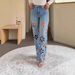 Designer Embroidered Jeans For Women – Distressed Denim Pants With Floral Cutouts & Rhinestone Details (Blue, Straight-Leg Fit)_mkmklike.com