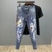 Spring And Autumn New Graffiti Printed Jeans Men's Fashion Slim-fit Elastic Small Feet Versatile Pants_mkmklike.com