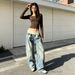 Women's Vintage Distressed Washed Deconstructed Jeans mid Rise Ribbed Waist Visible Stitching Pleats Wide Leg Silhouette_mkmklike.com