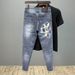Spring And Autumn New Graffiti Printed Jeans Men's Fashion Slim-fit Elastic Small Feet Versatile Pants_mkmklike.com