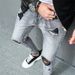 Perforated Solid Color Small Foot Elastic Men's Slim Fit Denim Selfie_mkmklike.com