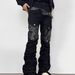 Men's Punk Rock Flared Jeans Asymmetric Leather-Patched Denim Stacked Knee Wrinkles Distressed Hem Street Goth Pants With Metal Zipper Accents_mkmklike.com