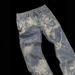 Men's Casual Washed Blue Jeans High Elasticity Loose Fitting Slightly Flared Distressed And Faded Finish With Totem Pattern_mkmklike.com