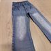 "Men's Vintage Washed Blue Flared Jeans – Parisian-Inspired Dirty Fit | Retro 70s Bell Bottoms | Lost Videotape Wash Effect"_mkmklike.com