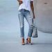 ELLE Source Goods Cross-Border Independent Station Women's Slim Fit Solid Color Versatile Ripped Straight Jeans_mkmklike.com