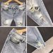 Ins Korean Version Men's Ripped Hole Slim Fit Nine Inch Jeans Summer Youth Fashion Light Blue Rotten Legs Tight Fitting_mkmklike.com