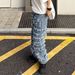 American High Street China-Chic Heavy Industry Washed Catwhisker Damaged Patch Jeans Old Beggar Fashion Slim Feet Pants_mkmklike.com