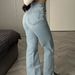 American Retro Niche Design Irregular Waist Slim-fit Hip-hugging Flared Jeans With Side Slits For Women_mkmklike.com