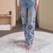 Designer Embroidered Jeans For Women – Distressed Denim Pants With Floral Cutouts & Rhinestone Details (Blue, Straight-Leg Fit)_mkmklike.com