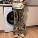 Men's Trendy Beggar Style Fake Hole Camouflage Patch Flared Straight Jeans Washed Niche Design Casual Pants_mkmklike.com