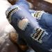Men's Slim Fit Skinny Jeans Elastic Pleated Patchwork Ripped with Appliques Cross Border New AM_mkmklike.com